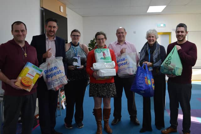 Nicholsons directors Richard Hallsworth, Kate Brown and Steve Robinson delivered items to the New Life Food Bank