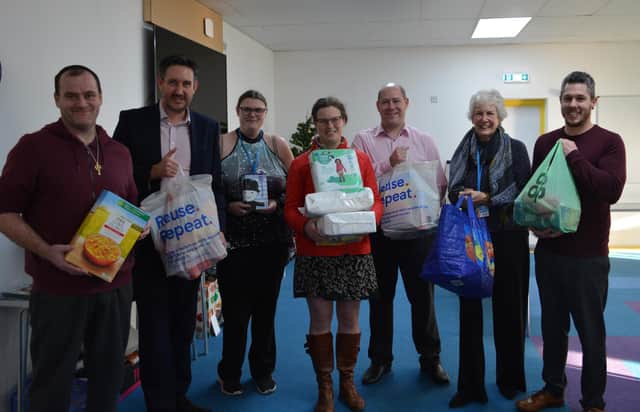 Nicholsons directors Richard Hallsworth, Kate Brown and Steve Robinson delivered items to the New Life Food Bank