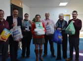 Nicholsons directors Richard Hallsworth, Kate Brown and Steve Robinson delivered items to the New Life Food Bank