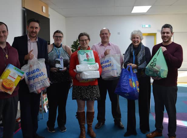 Nicholsons directors Richard Hallsworth, Kate Brown and Steve Robinson delivered items to the New Life Food Bank
