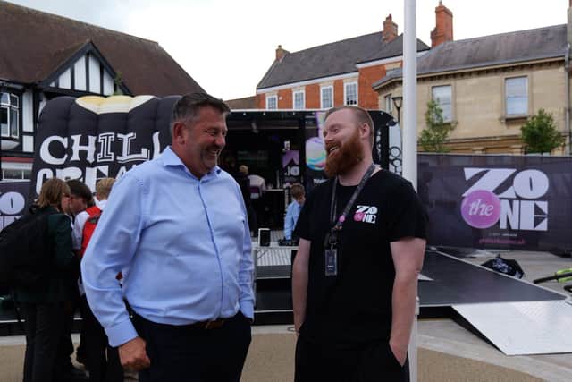 Council Leader Cllr Richard Wright speaks with a member of The Zone team.