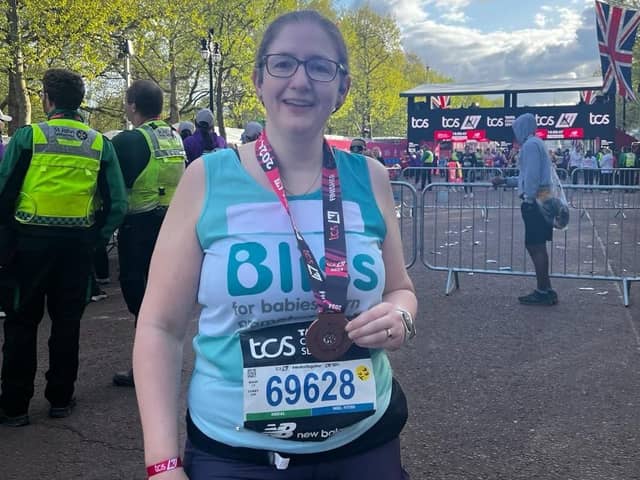 Dr Caroline Johnson with her medal at the London Marathon finish line. Photo supplied