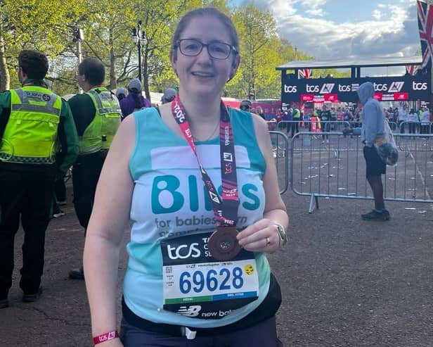 Dr Caroline Johnson with her medal at the London Marathon finish line. Photo supplied