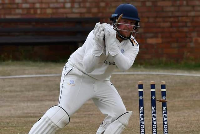 Matthew Wing in wicketkeeper action in Sleaford's defeat by Woodhall Spa.