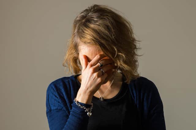 PICTURE POSED BY MODEL A woman showing signs of depression.