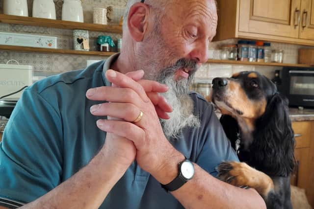 David shares a loving look with one of the dogs.