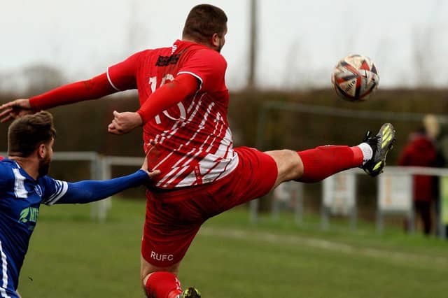 Cole Nelson challenges for the ball on Saturday.
