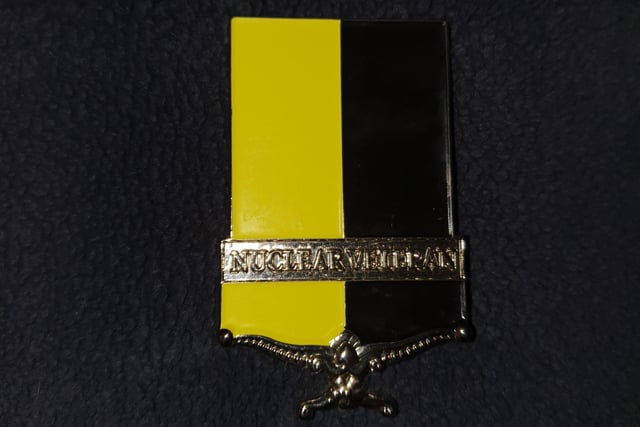John's Nuclear Test Veterans badge.