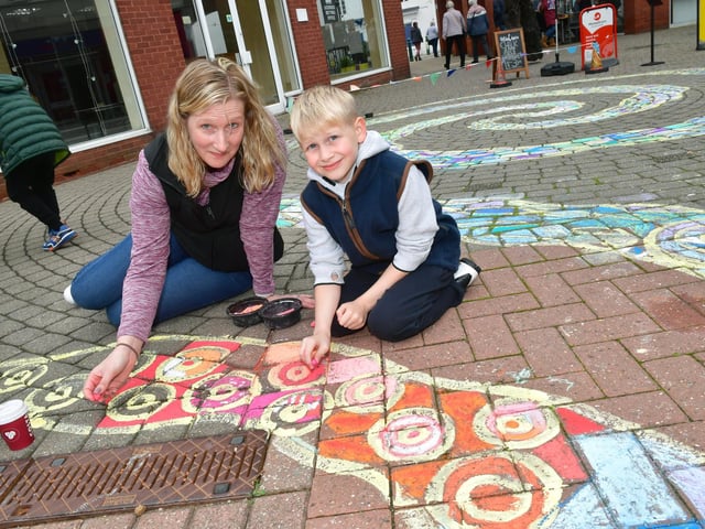 Anna Skeith and Reuben Skeith 8 of Sleaford trying the Italian chalking art in Riverside Precinct.