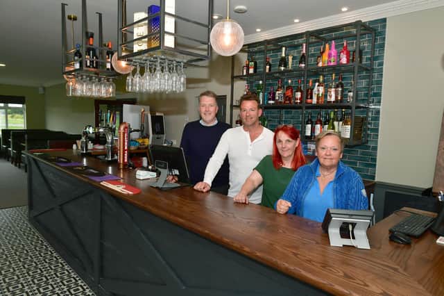 Coastfields bosses behind the new bar at Addlethorpe Golf and Country Club are David Honman, business manager, Lloyd Silvester, managing director, golf club manager Carol Hallgarth and Lynda Silvester, chairman.