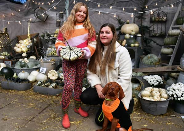 Miah and Annatha Skinner with Oscar the dog.