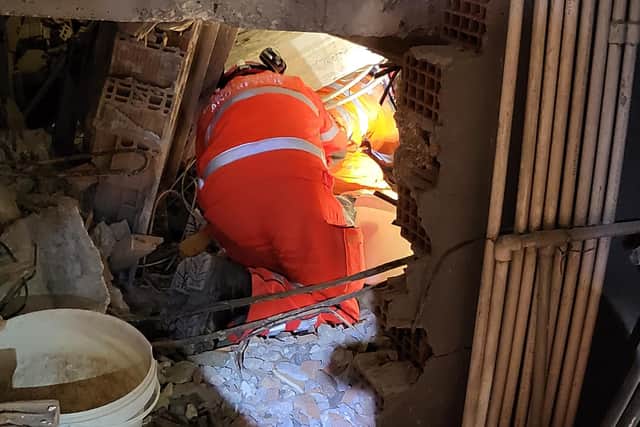 Colin Calam and Neil Woodmansey spent hours working in a tunnel to rescue survivors of the collapsed hotel.