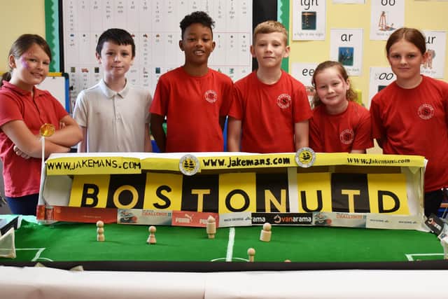 Staniland Academy pupils with their scale model of Boston United Stadium.