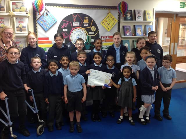 Pupils at Boston's St Nicholas CofE Primary Academy with Louise Curtis, learning mentor/DDSL.