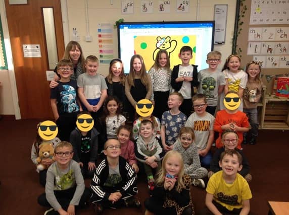 Teacher Mrs Suzanne Rutherford with her class.