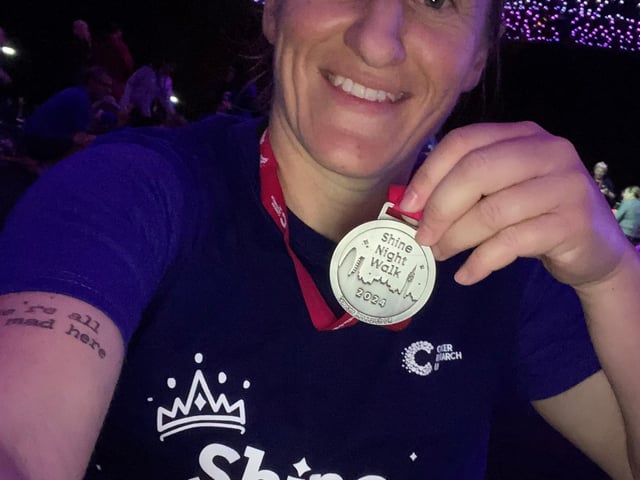 Rachael with her Shine Walk London Marathon medal.