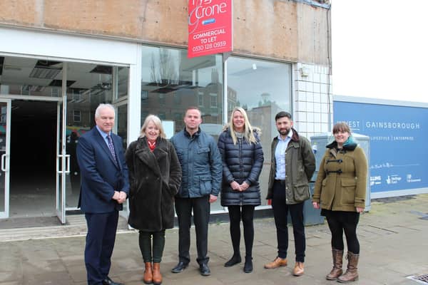 Coun Trevor Young, Coun Lesley Rollings, Dave Horsley, Wendy Osgodby, Jasper Caudwell and Abigail Buckland outside the vacant building