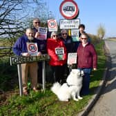 Thimbleby residents campaigning for 30mph speed limit, from left: John Swinn, Mike Clarke, Chris Holmes, Dennis Holmes, Jonathan Lincoln and Jan Clarke with her dog Alek. Photo: