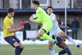 Matt Yates comes out to claim a cross.