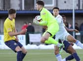 Matt Yates comes out to claim a cross.