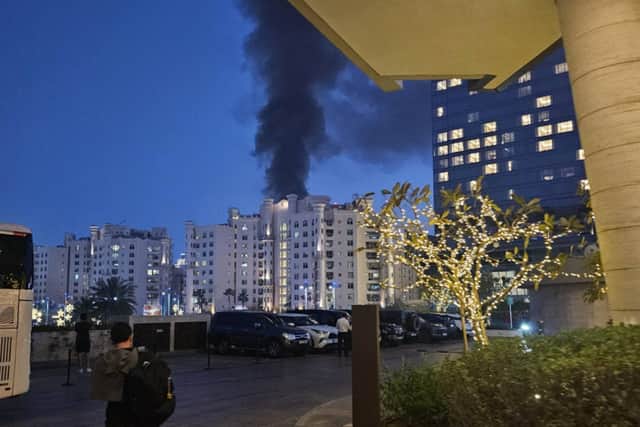 Smoke billows from the Fairmont The Palm hotel just 500 yards away from Mick and Tina Brommell's own hotel in Dubai. Photo Mick Brommell