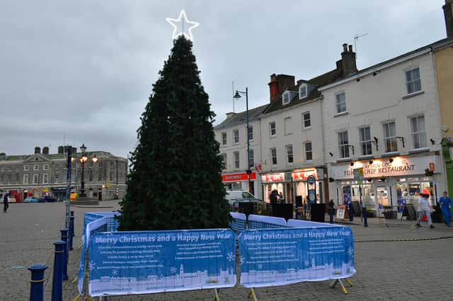 The new Christmas tree in the Market Place pictured before its lights came on.