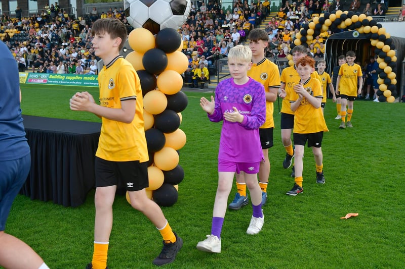 Junior teams cheered onto the pitch.