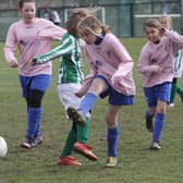 Kids can mix in school but not on the football pitches away from school.