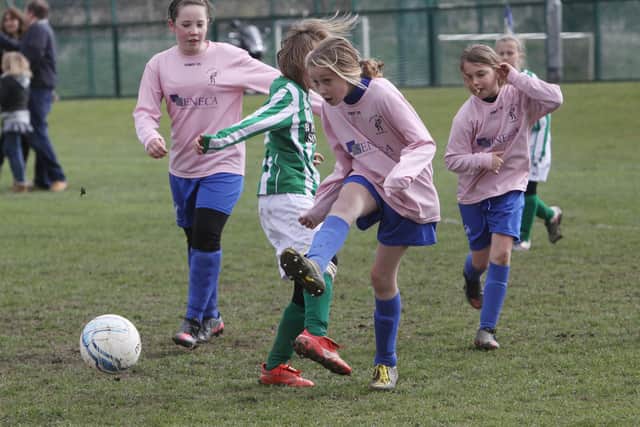 Kids can mix in school but not on the football pitches away from school.