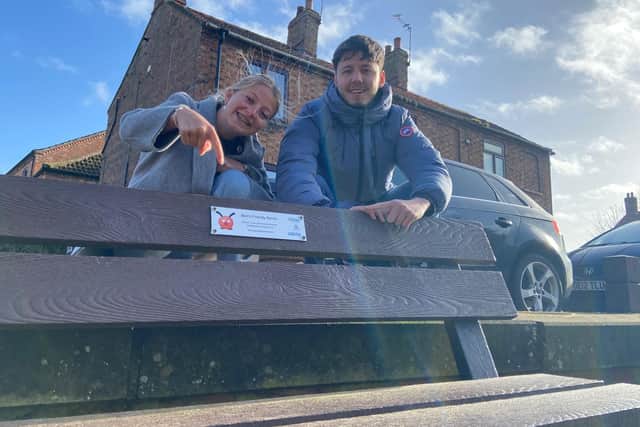 Community hub workers Amber Hodgson and Dan Carrick, of mental health charity Shine Lincolnshire, at one of Bert's Benches in Horncastle. (PHOTO BY: Shine Lincolnshire)
