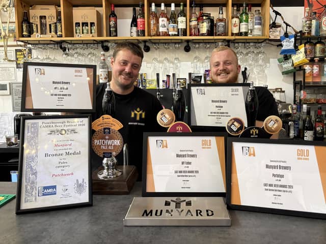 Munyard Brewery owner Oliver Munyard (left) and apprentice Jack Midgley with the awards won at the beer festival.