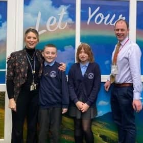 Matt Warman, MP for Boston and Skegness, and headteacher Fiona Booth, with St Nicholas pupils.