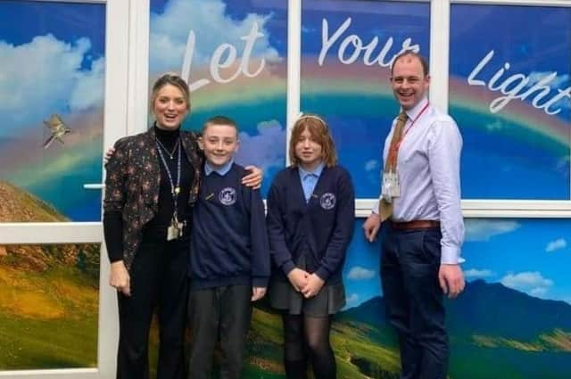 Matt Warman, MP for Boston and Skegness, and headteacher Fiona Booth, with St Nicholas pupils.