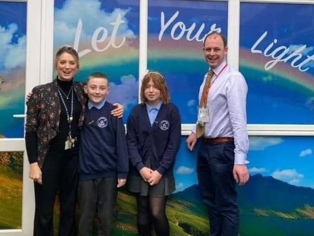 Matt Warman, MP for Boston and Skegness, and headteacher Fiona Booth, with St Nicholas pupils.