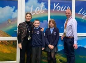 Matt Warman, MP for Boston and Skegness, and headteacher Fiona Booth, with St Nicholas pupils.