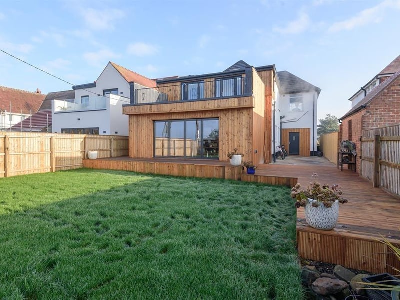 The rear of the property with the balcony on show.