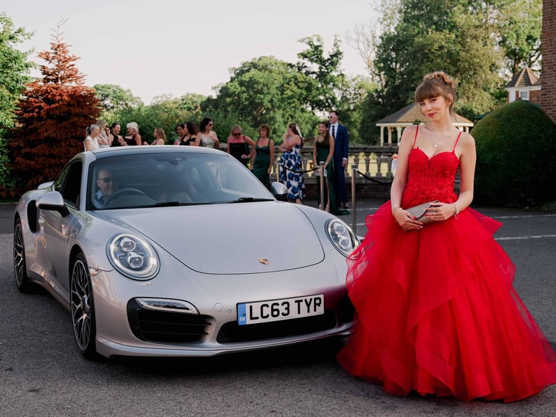 Pleased with her sports car arrival at Louth Academy prom.