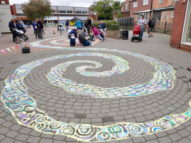 Having a go at Italian chalk art in Riverside Precinct.