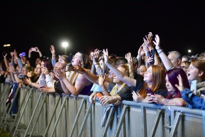 Excited fans enjoying the show.