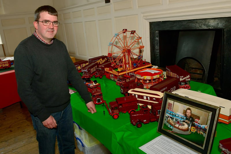 One of the organisers, Glyn Halgarth, with a tribute display of models made by Chris Hudson.