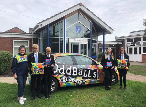 Trudie McCarthy, ambassador for The OddBalls Foundation, with pupils from Somercotes Academy.
