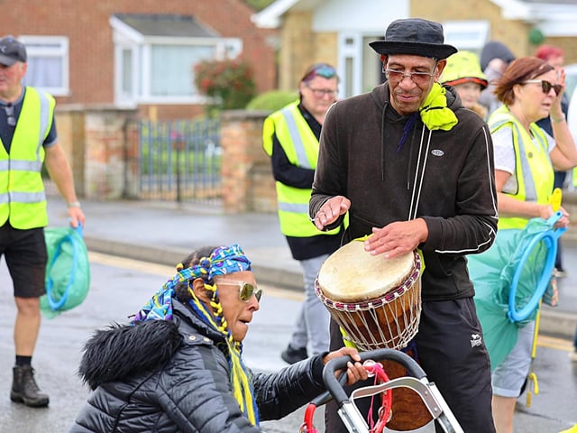 Don't stop de carnival! Are they litter pickers in the background?