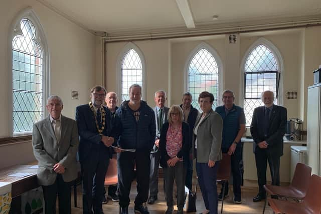 Coun Bunney, second left, on his visit to Keelby. Image: WLDC