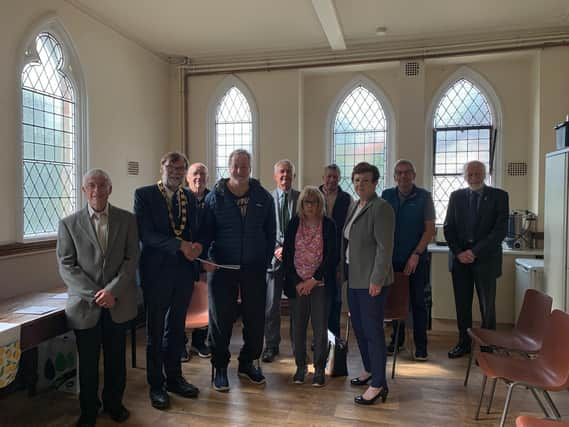 Coun Bunney, second left, on his visit to Keelby. Image: WLDC