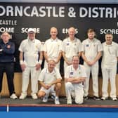 Seven of the eight home Denny Plate team. Umpire Les Smith, team members (l-r) Norman Burton, Keith Jackman, Mark Burn, Chris Parker, Brent Rickard. (Kneeling l-r) Paul Bark and John Rapley.