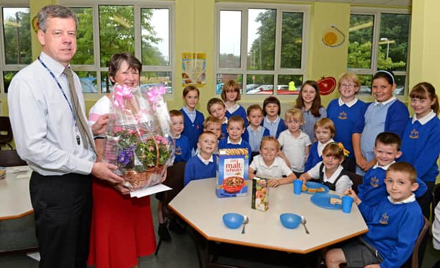 Horncastle Primary School headteacher Andy Craven with retiring Breakfast Club co-ordinator Janet Padley. Janet had overseen the club since 2004 and worked at the school for more than 19 years.
