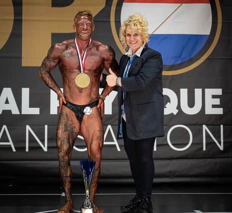 Tim McGibbon is named Classic Physique and Overall Classic winner at the Battle of Den Helder.