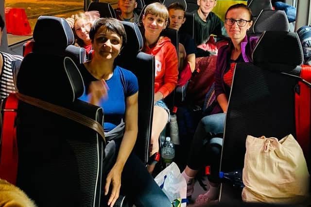 The Ukrainian refugees on the bus on the way back to the UK.