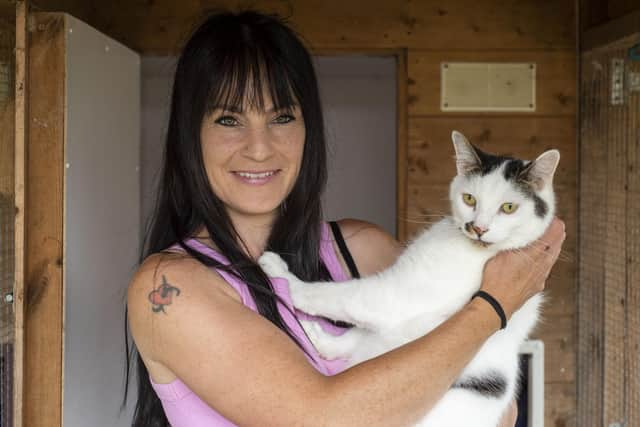 Ark volunteer Emma Murphy with Parker the rescue cat.