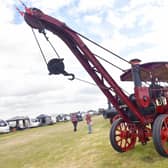 L-R John Foxton and Caroline Foxton of Frithville, Dave Webster of Bicker, looking at a Burrell and Sons steam crane 'The Lark', owned by Robert Crawford of Frithville